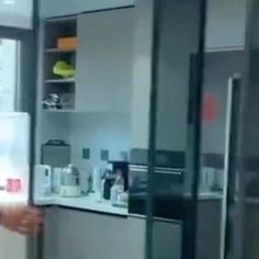 a man standing in front of a refrigerator freezer