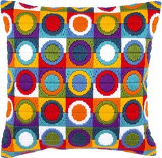 a multicolored pillow with circles on it