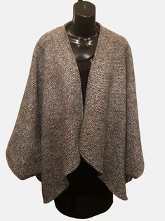 Wool and polyester blend Boucle Crop length Classic wrap with signature matching scarf. Handcrafted, Dry clean Wool Poncho For Workwear, Classic Long Sleeve Fall Cape, Classic Wool Cape For Fall, Chic Wool Poncho For Winter, Casual Fall Outerwear With Scarf, Chic Wool Cape For Fall, Elegant Fall Poncho For Workwear, Elegant Wool Cape For Fall, Elegant Fall Poncho For Work