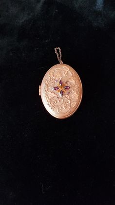 In mint condition, this unique locket box  weighs a hefty 4.7 oz. and would need a strong chain to wear with it.  I think perhaps it was made more as a display item or for collectors. So, grab this now if you are a collector or just love the unique look of this piece. Rose Gold Locket Necklace For Formal Occasions, Victorian Medallion Jewelry With Hallmark, Formal Victorian Hallmarked Locket Necklace, Antique Hallmarked Pendant Jewelry, Antique Pendant Jewelry With Hallmark, Collectible Heirloom Jewelry With Large Pendant, Elegant Compact Locket Jewelry, Heirloom Jewelry With Large Pendant For Collectors, Formal Engraved Purple Jewelry