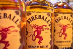 three bottles of fireball cinnamon whiskey are lined up