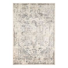 an area rug with grey and white colors on the floor, including a large medallion design