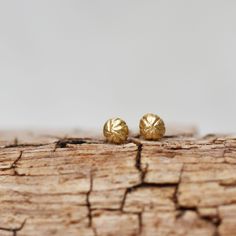 Sweetest little handmade flower bud post earrings. Each earring is hand carved out go solid gold. These are the perfect choice for everyday wear. Details- Size - about 5mm's in diameter Gold - 14k, choose yellow or rose Finish - Brushed These earrings are made to order. Thanks for looking! Lilian Hypoallergenic Recycled Gold Earrings For Gifts, Dainty Hand Forged Earrings For Gift, Dainty Hand Forged Earrings As Gift, Nature-inspired Hammered Earrings As Gift, Nature-inspired Yellow Gold Earrings For Gift, Sterling Silver Birthstone Ring, Gold Amethyst Ring, Lake Oswego, Handmade Flower