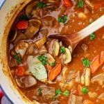 a large pot filled with stew and vegetables