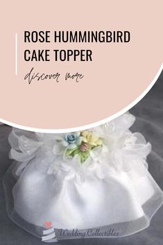 a white bag with flowers on it and the words rose hummingbird cake topper above it