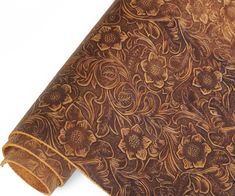 a close up view of a brown floral pattern