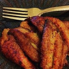 some fried food on a plate with a fork