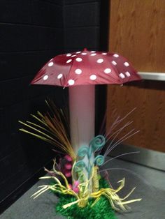 a pink umbrella sitting on top of a table