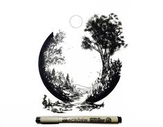 a pen is sitting next to a drawing of a tree in the shape of a circle