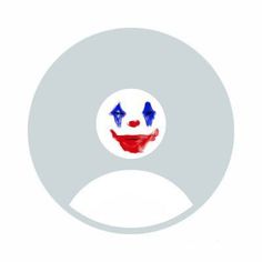 the face of a clown painted in red, white and blue