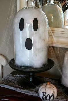 a ghost jar sitting on top of a table