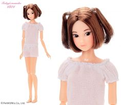 the doll is wearing a white dress