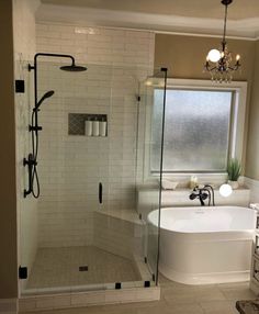 a bathroom with a tub, shower and sink