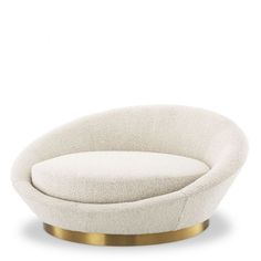 an oval chair with a gold base and white upholstered fabric on the back