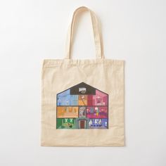 a tote bag with an image of a house on the front and colorful houses on the back