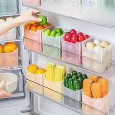 the refrigerator door is open and filled with fruits and vegetables