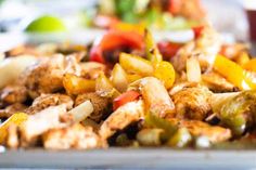 a close up of a plate of food with meat and vegetables on it's side