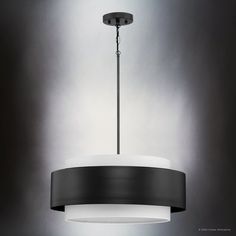 a black and white light fixture hanging from a ceiling