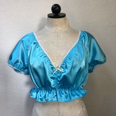 Satin babydoll style top with ruffled trim. Coquette Ruffled Tops For Spring, Spring Coquette Tops With Ruffles, Fitted Satin Top With Ruffles, Satin Ruffle Tops, Satin Babydoll, Womens Blouses, Babydoll Style, Lovely Dresses, Top Photo