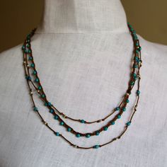 "Super-cute minimalist layered necklace - one is natural braided waxed cotton cord with turquoise faceted beads. The second necklace is long and hand-knotted with tiny, precious sterling silver beads. You have dual looks - wear the long necklace long for a dramatic effect, or doubled for a layered look. Details for both necklaces: * Handmade * Necklace lengths: 22\" and * Closure: * Style: Bohemian, beachy, summery" Glass Bead Necklaces, Faceted Glass Bead Necklace, Natural Braids, Necklaces Handmade, Cowhide Bag, Bead Necklaces, Necklace Long, Multi Strand Necklace, Layered Necklace