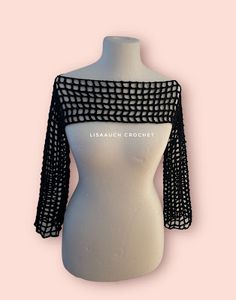 a white mannequin with black mesh on it