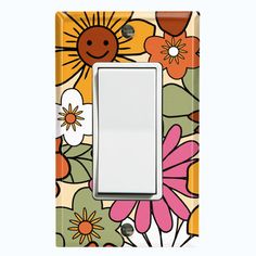 a light switch cover with colorful flowers and smiley faces on the front, white background