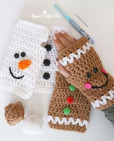 two crocheted snowmen are on the table