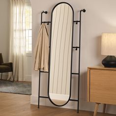 a mirror and coat rack in a room