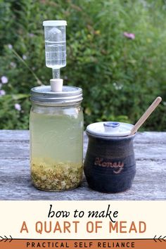 a mason jar filled with liquid next to a canister full of seeds and herbs