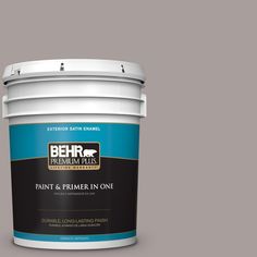 a bucket of behr paint on a blue background