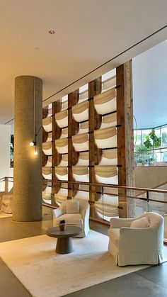 a living room filled with lots of white furniture