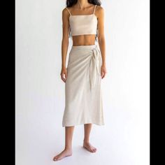 Beautiful Linen Blend Skirt With Elastic Back Waist, Tie, And Side Zipper. Has Lining That Almost Reaches The Knee. New With Tags. I Bought It On A Whim But Haven’t Worn It Because It’s A Little Long On Me. It Still Is An Okay Length On Me But I Wish It Was A Little Shorter And Fit Like It Does On The Model. Beige Wrap Skirt For Summer Day Out, Wrap Beach Skirt With Lining, Beach Wrap Skirt With Lining, Fitted Tie Waist Skirt For Beach, Relaxed Wrap Skirt For Beach, Relaxed Fit Wrap Skirt For Beach, Beach Wrap Skirt With Relaxed Fit, Beige Wrap Skirt For Summer Beach, Beige Beachwear Skirt For Spring