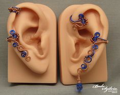 Wire wrapped ear wrap set in copper and blue with crystals, no piercing required. It's made of raw copper and blue artistic wire, seed beads and swarovski crystals. Available: - bigger ear cuff - left ear - bigger ear cuff - right ear Made for order. I'll need 1-5 days to make your ear cuff. Please note that each piece is made 100% by hand and may vary a little from the photo. You can find more ear cuff/wrap sets here: https://www.etsy.com/shop/bodaszilvia?ref=seller-platform-mcnav&section_id=35 Adjustable Blue Cartilage Earrings, Adjustable Blue Ear Cuff For Gifts, Handmade Copper Ear Cuff With Unique Style, Unique Handmade Copper Ear Cuff, Handmade Unique Copper Ear Cuff, Ear Cuff Diy, Ear Wrap Cuff, Ear Wraps, Wire Ear Cuffs