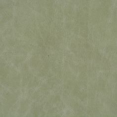 a green leather textured background or wallpaper