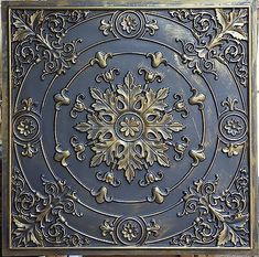 an ornately designed metal panel with gold accents