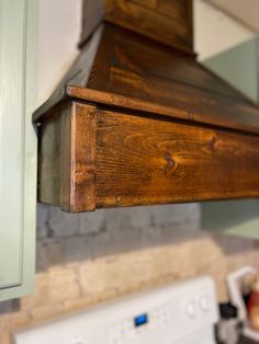 a stove top oven sitting inside of a kitchen