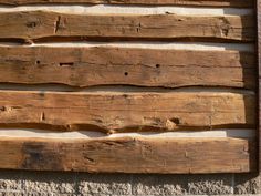 some wood planks that are on the side of a building with holes in them