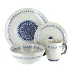 blue and white dinnerware set with saucer, bowl and cup on the side