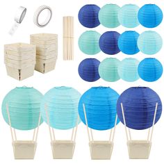 blue and white paper lanterns are arranged in rows, along with other items for decoration