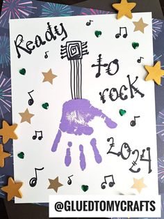 a handprinted card with the words ready to rock and music notes on it