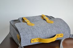 "17-inch Macbook case, 17-inch messenger bag,crossbody bag, felt bag, office bag, felt satchel,office bag, work bag, school sachel More colors: https://www.etsy.com/shop/BPStudioDesign?ref=seller-platform-mcnav&section_id=21510241 This beautiful and comfortable laptop bag is made from tender shock-absorbing felt fabric. This bag is made of 100% felt and genuine leather. It can be used as an excellet office bag, laptop bag, briefcase, school bag, messenger bag, or satchel. It can hold a Macbo Leather Strap Bag, Macbook Bag, School Satchel, Laptop Messenger Bags, Laptop Bag For Women, Macbook Laptop, Office Bag, Messenger Bag Men, Felt Bag