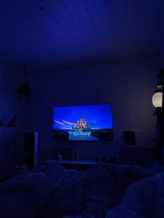 a large screen tv sitting in the middle of a living room