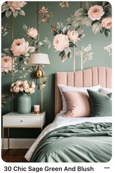 a bedroom decorated in green and pink with flowers on the wall behind the headboard