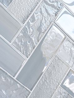 a close up view of white glass tile