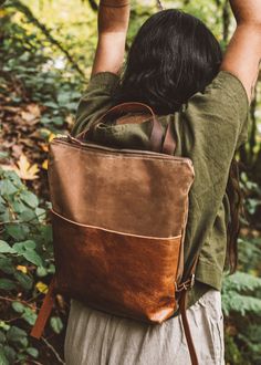 "Introducing our Strathcona Backpack -  made with waxed canvas and paired with our genuine leather, the Strathcona makes the perfect lightweight bag, great for the everyday essentials. The Japanese printed accent pieces on the front doubles as a deep pocket and it also features a zipper closure and adjustable leather straps. * Made from American made tan waxed canvas * Front pocket in rusty brown cowhide leather * Brown cowhide adjustable backpack straps * Thick natural off-white canvas lining with one inner pocket * Measures 13.5\" across x 12\" in height to 3\" gusset * Brass YKK metal zipper and leather zipper pull * Handle on top with a 3\" drop Waxed canvas is a durable, weather resistant material that can be wiped clean. This material has a softness with natural creases that will var Leather Diaper Bag Backpack, Stylish Laptop Bag, Hipster Backpack, Stylish Diaper Bag, Waxed Canvas Backpack, Waxed Canvas Bag, Ethnic Bag, Utility Bag, Women Leather Backpack