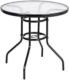 a glass table with metal legs and a round top on an isolated white background, viewed from the front