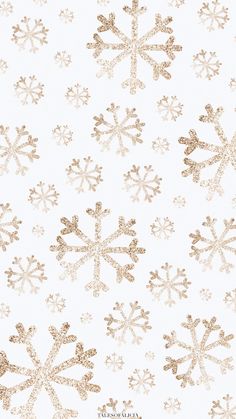 a white and gold snowflake pattern on a white background