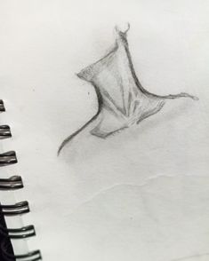 a pencil drawing of a leaf on paper