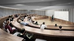 an auditorium with people sitting at tables and one person standing in front of the audience