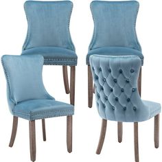 two blue velvet chairs with buttons on the back and sides, one is upholstered